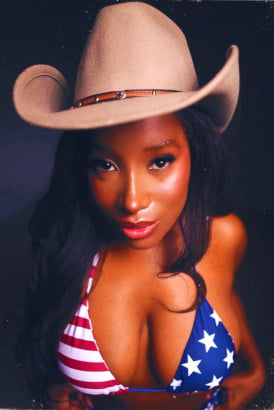 Black girl in a cowboy hat and stars and stripes bikini